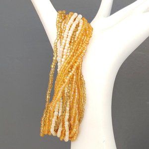 Gold, honey, cream multi strand seed bead bracelet